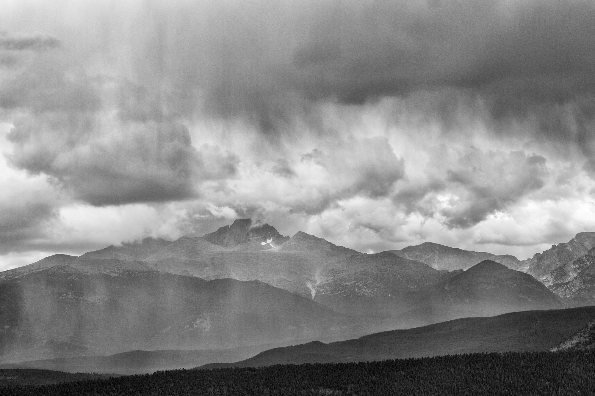 Passing thunderstorm over mountains in Rocky Mountains-Cloudburst