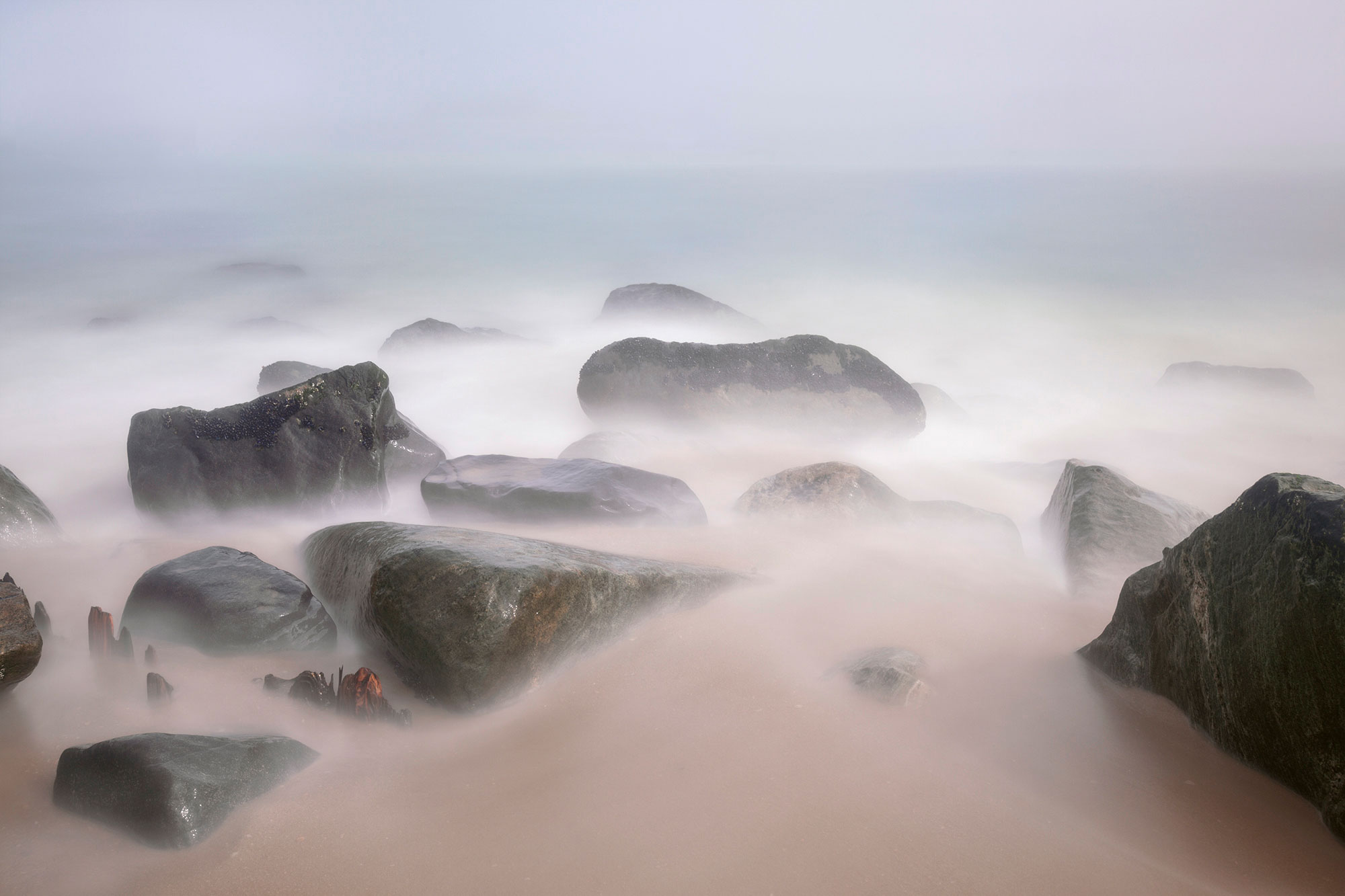 Ocean mist over rocks at Sandy Hook Beach New Jersey-Mist