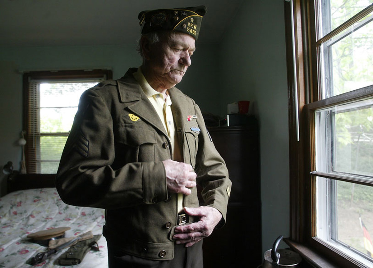 WWII Army vet trying on old uniform-New Jersey Portrait Photographere